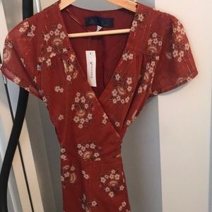 Brand new flowery wrap top.